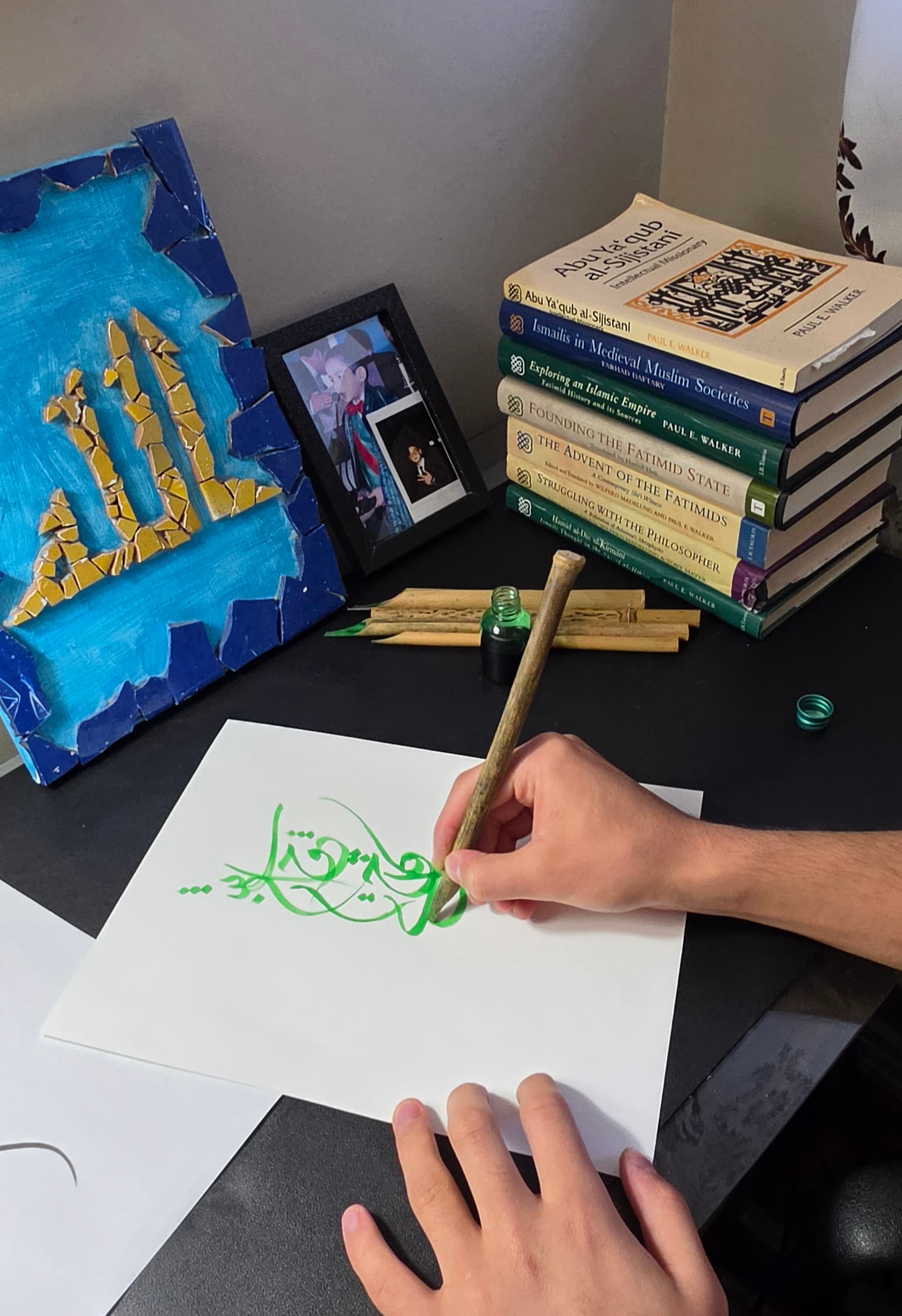 The founder writing calligraphy